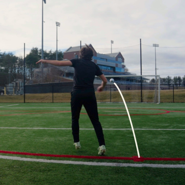 Player striking a soccer ball during training.